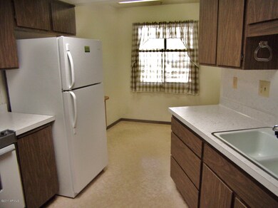 Kitchen looking into eat in area