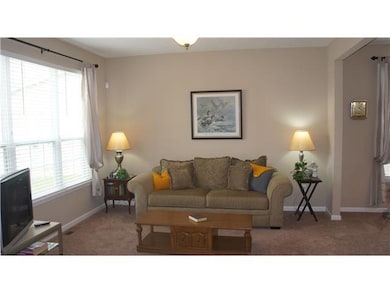 Living Room. Formal living room right off the foyer, open to the dining room.