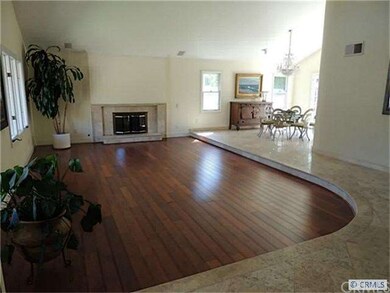 Sunken Living Room with maribu Hardwood Flooring