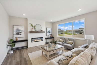 Living Room - photo is of a previous inventory home. Inquire for more details and options.