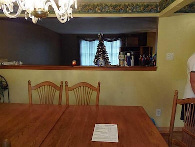 Dining Room. HALF WALL IS HIGH ENOUGH FOR FURNITUR