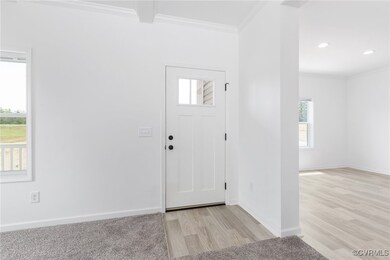 Foyer entrance with a wealth of natural light, cro
