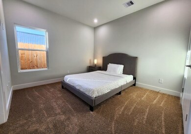 This bedroom features a minimalist design with neu