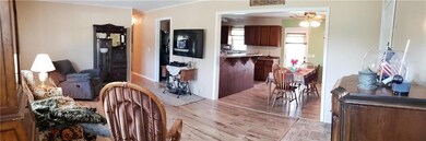 Panorama of entrance into spacious living room tha