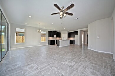 Family Room has also the beautiful Large Tile Floors that flows into the Casual Dining and Gourmet Kitchen! Upgraded Ceiling Fan and more!