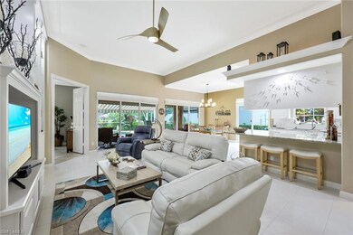 Tiled living room with ornamental molding and ceil