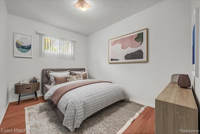 Bedroom #3 with wood finished floors