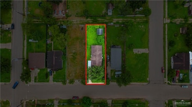 Aerial view of property and surrounding area featuring property parcel outlined