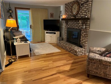 Family room with hardwood floors and lovely sunroo