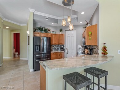 Kitchen with refrigerator with ice dispenser, a pe
