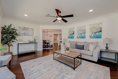 This is a spacious, well-lit living room featuring