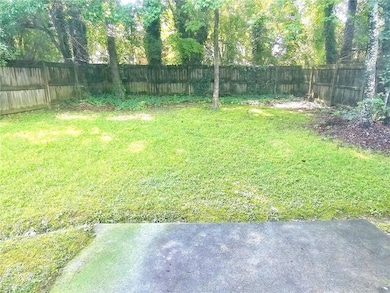View of fenced backyard