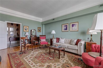 Family room/guest bedroom with wood flooring and p