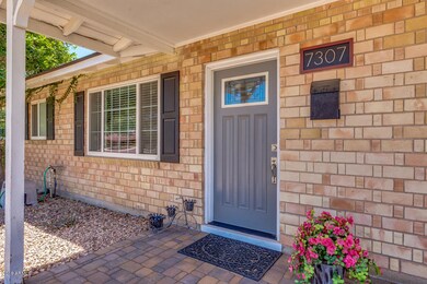 WELCOMING ENTRY TO CARPORT