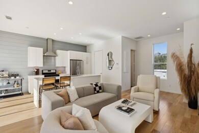 Living room with wood walls and light wood-type fl