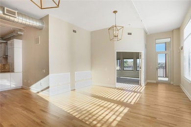 Spare room featuring light wood-type flooring, vis