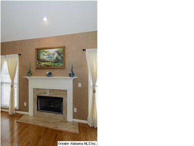 The fireplace has gas-logs, great marble and wood 