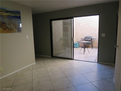 This view shows the dining room with glass sliding