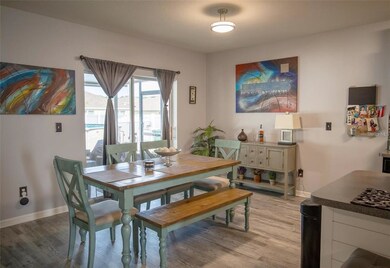 Dining Room Slider Leads to Cover Lanai, Backyard 