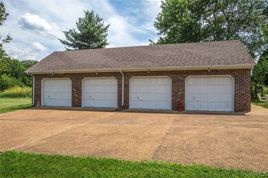4 car garage with storage above & new roof 6/16