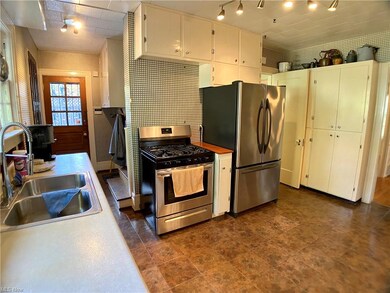 Kitchen has newer stainless steel appliances.