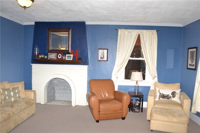 Living room with decorative fireplace.