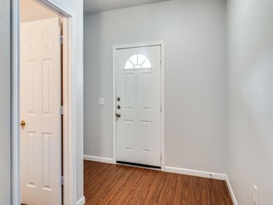 Entrance foyer featuring dark hardwood / wood-styl