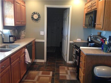 Kitchen updated with quartz counters and stainless appliances.