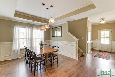 Dining Room with Wainscoting and Tray Ceiling