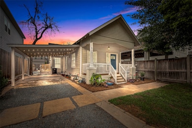 Night shot of this lovely single-story bungalow wi