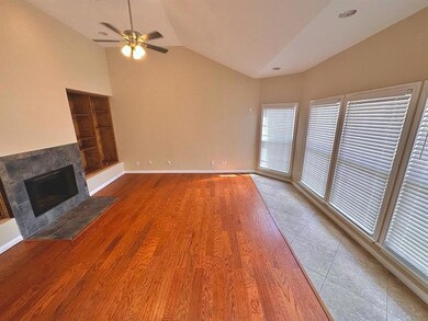 Unfurnished living room with vaulted ceiling, a c