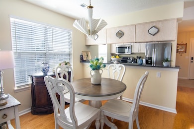 Dining area featuring baseboards, visible vents, a