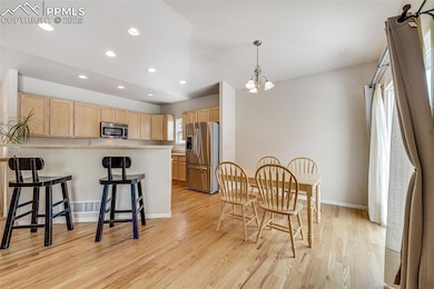 The kitchen opens to a great room, and has a walkout to the fenced back yard.