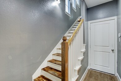 Once in the front door the traditional staircase g