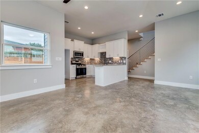Kitchen featuring appliances with stainless steel