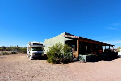 -front of home with RV