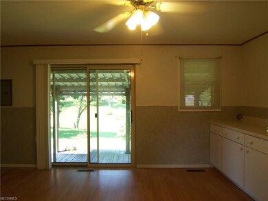 The kitchen has sliders to the covered back deck t