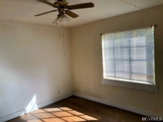 Unfurnished room with ceiling fan and light hardwo
