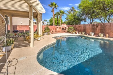View of swimming pool with a patio area, a fenced