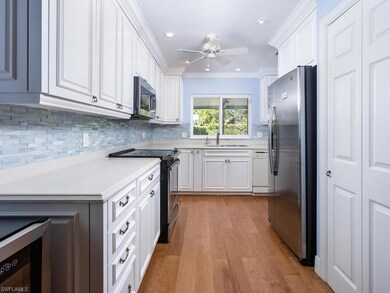 Kitchen featuring light countertops, wine cooler, 