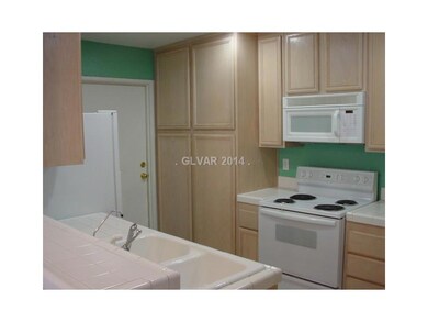 Property Photo. Kitchen Stove/Microwave/Pantry