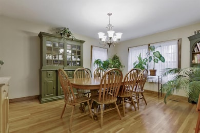 House has formal dining room with hardwood floors.