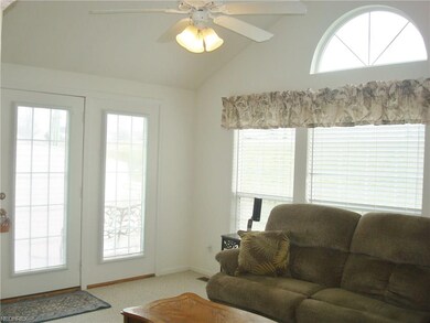 French doors, with internal blinds, leads to the d