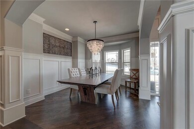 Super chic chandelier, crown molding, and trim in 