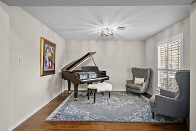 Enter the home to a two-story foyer with a formal living room on the right (can also be used as a formal dining room).