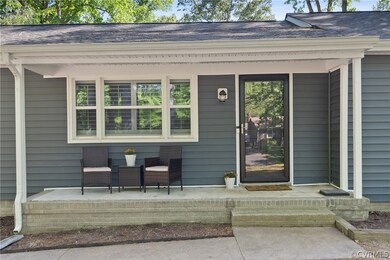 View of exterior entry with covered porch