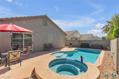View of pool with a fenced backyard, a patio, and