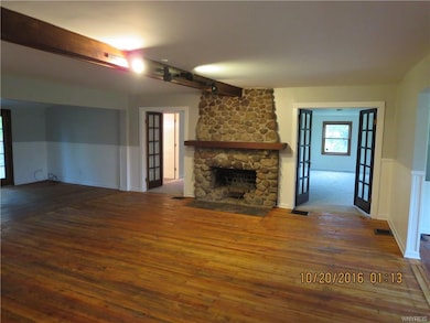 Living Room with beautiful stone faced fireplace f
