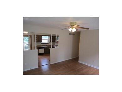 The living room leads into the kitchen, love the o