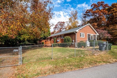 Rear view of home and fenced back yard.